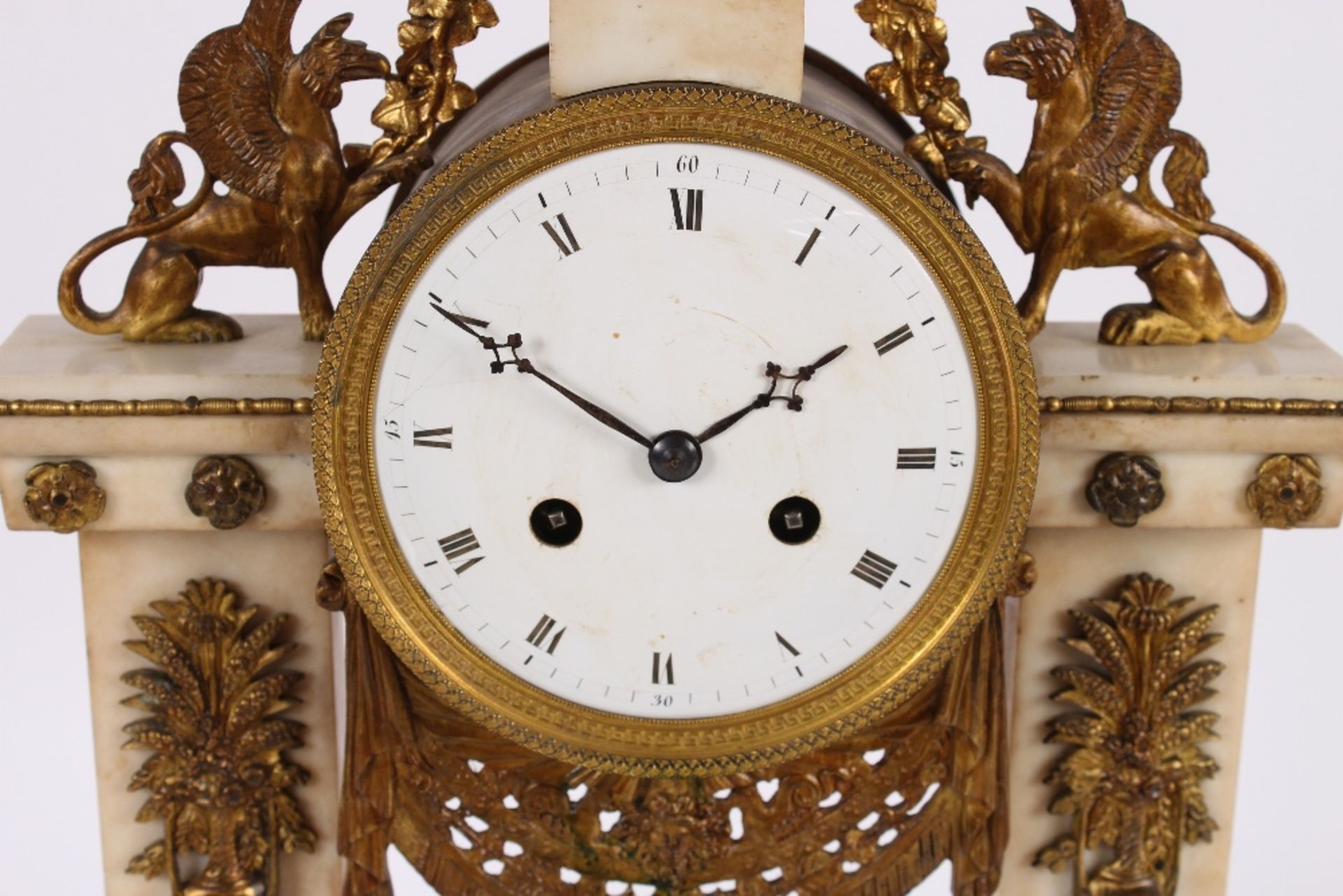 A 19th Century French marble and ormolu mounted mantel clock, surmounted by griffins and garlands, - Image 3 of 6