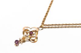 A 9ct gold and amethyst floral pendant hung to a fine 9ct gold chain, 7.5gms total weight