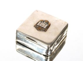 A silver cigarette box, the lid decorated with a crest and inscribed to verso "Capt. M.B. Thompson