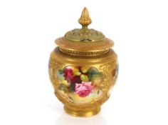 A Royal Worcester Pot Pourrie vase and cover, painted with panels of roses heightened in gilt, the