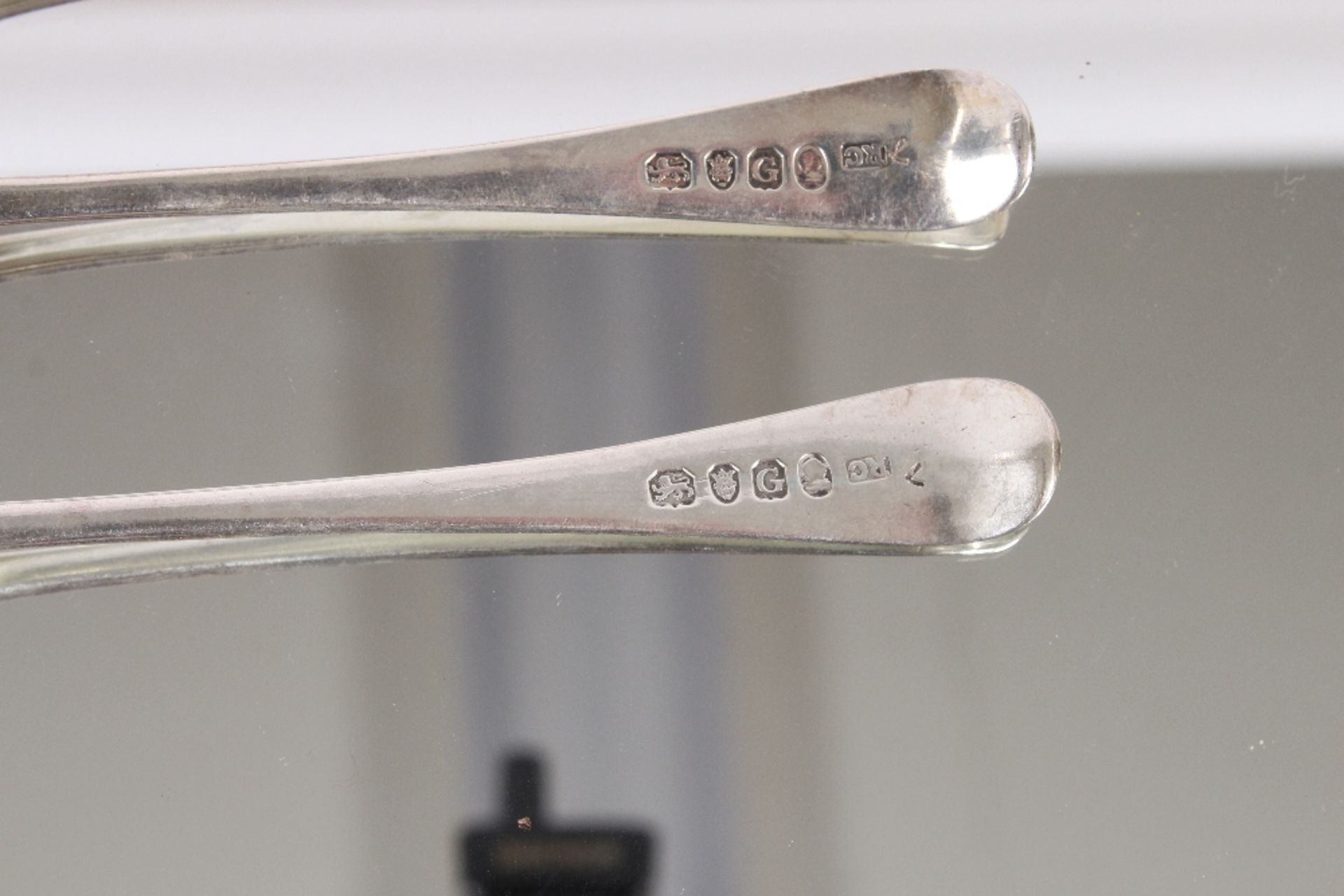 Nine George III silver "Old English" pattern dessert spoons, bearing family crests, London 1802; and - Image 3 of 8