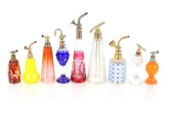 A quantity of various glass scent bottles and atom