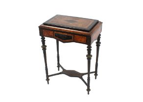 A 19th Century walnut and ebonised jardinière table, with hinged lifting top, raised above gilt