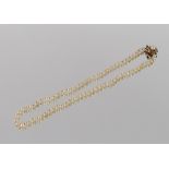 A pearl necklace, set to a 9ct gold clasp with central large pearl