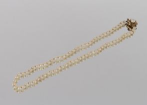 A pearl necklace, set to a 9ct gold clasp with central large pearl