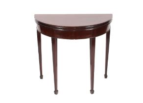 A 19th Century mahogany demi-lune shaped fold-over tea table, of small proportions raised on