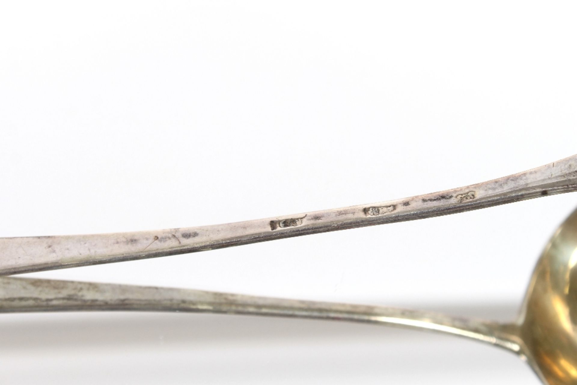 A George III silver soup ladle, with scroll handle decorated monogram and family crest marks - Image 3 of 3