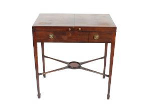 A George III mahogany enclosed dressing table, the fold out hinged top opening to reveal an interior