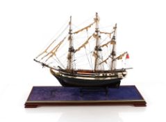 A model of a three masted sailing vessel, contained in case, 72.5cm long overall x 58cm high