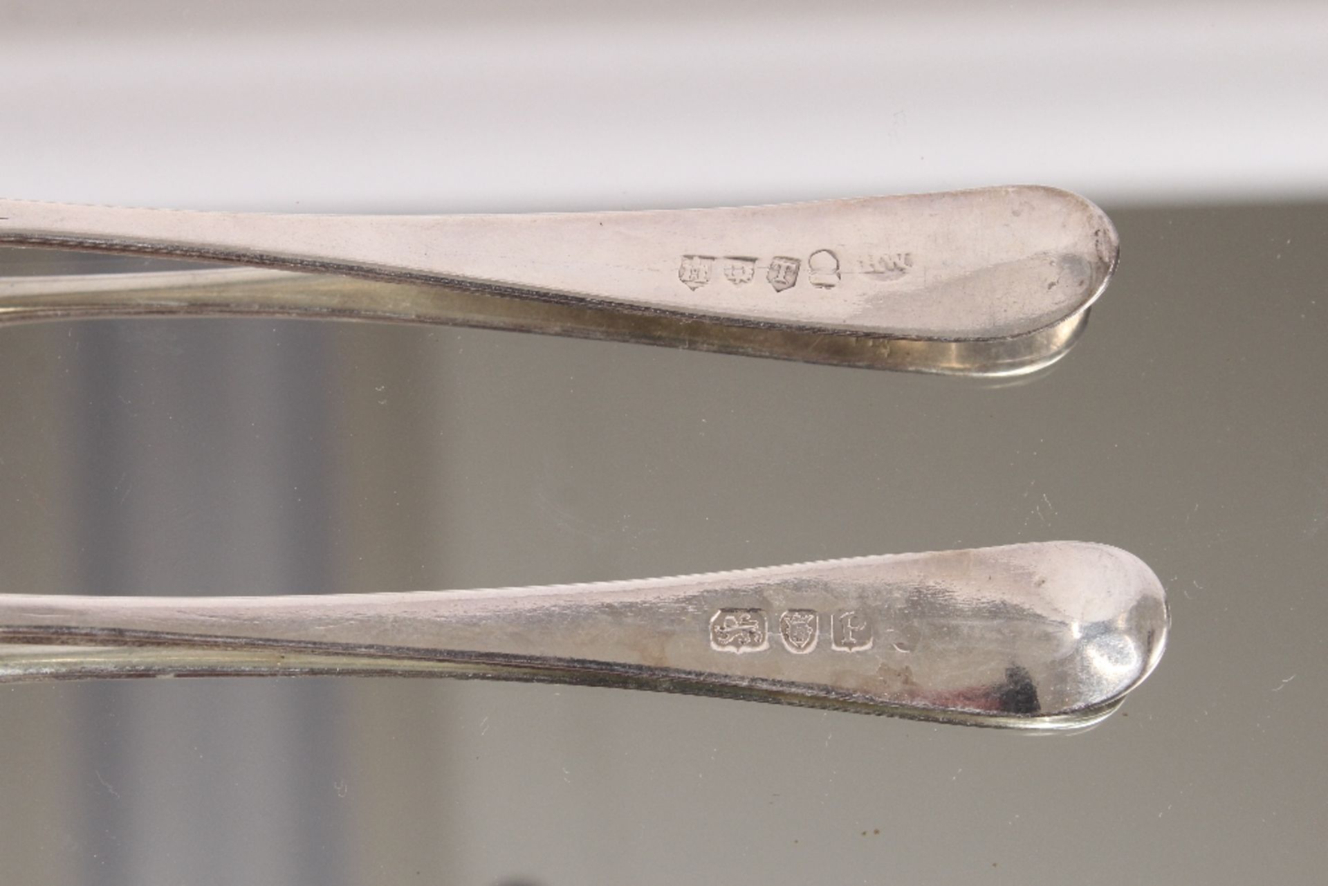 Nine George III silver "Old English" pattern dessert spoons, bearing family crests, London 1802; and - Image 6 of 8