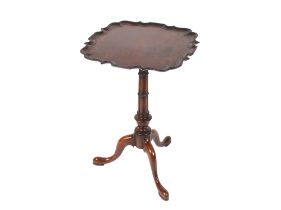 A George III style mahogany occasional table, having pie crust bordered top raised on cluster column