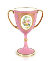 A 19th Century Minton's baluster cup, decorated with a finely painted foliate panel within gilt