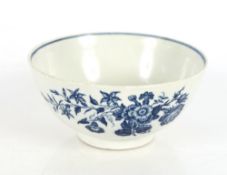 An 18th Century Royal Worcester bowl, decorated flowers and butterflies, under glazed blue