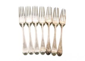 Three Edwardian silver "Old English" pattern dinner forks, London 1908; and four George III silver