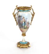 A 19th Century French porcelain and gilt metal mounted urn of baluster shape decorated with a maiden