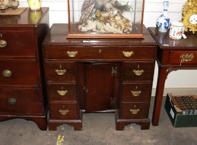 A 19th Century mahogany kneehole desk, fitted single frieze drawer above a central cupboard, flanked