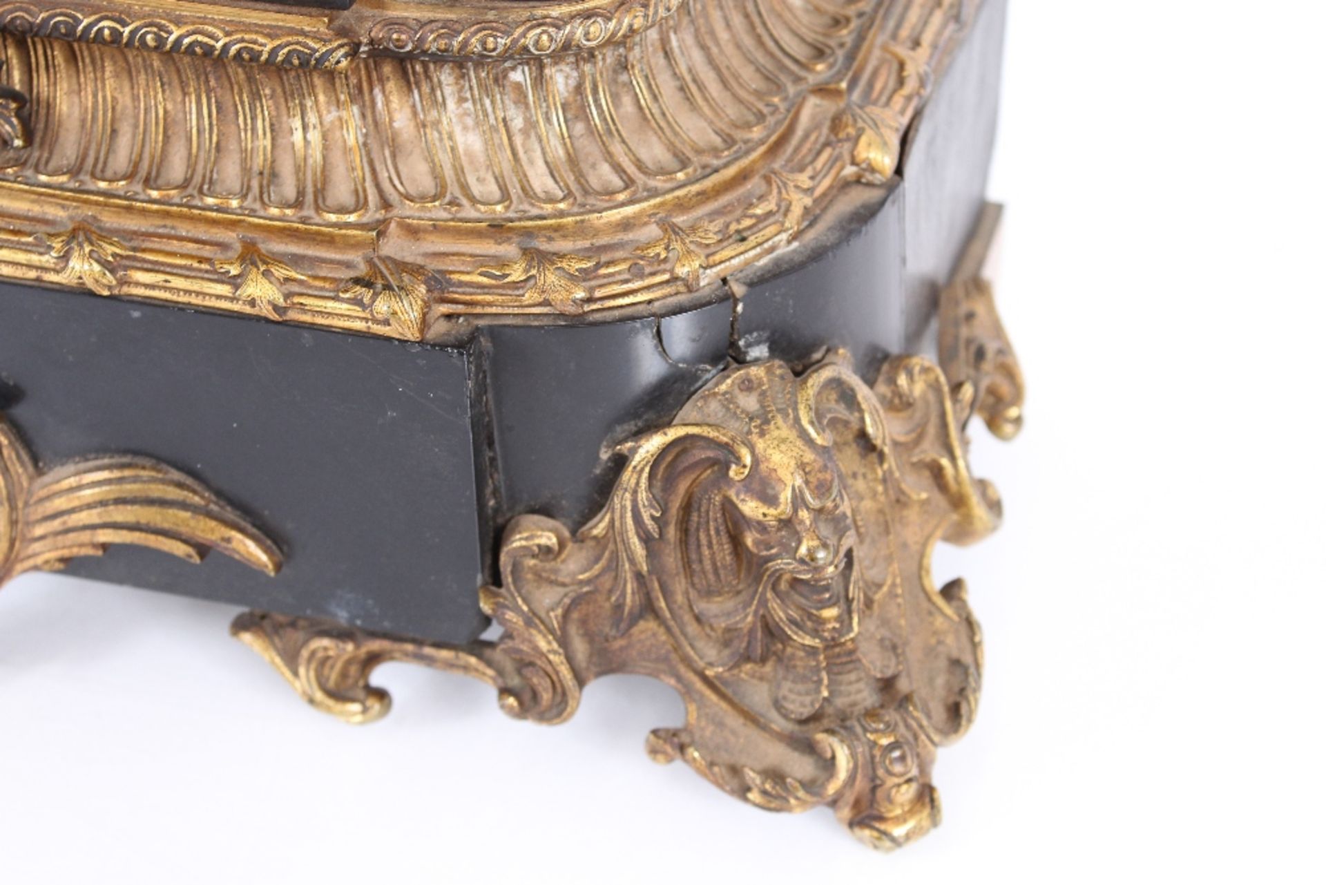 A 19th Century French black marble and Ormolu mounted mantel clock, surmounted by a seated bronze - Image 3 of 4