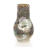 A Japanese pottery vase, decorated birds and foliage, 31cm high