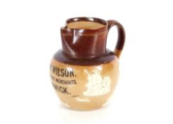 A Doulton Harvest ware baluster jug, inscribed G. & W. Wilson Wine and Spirit Merchants Alnwick,