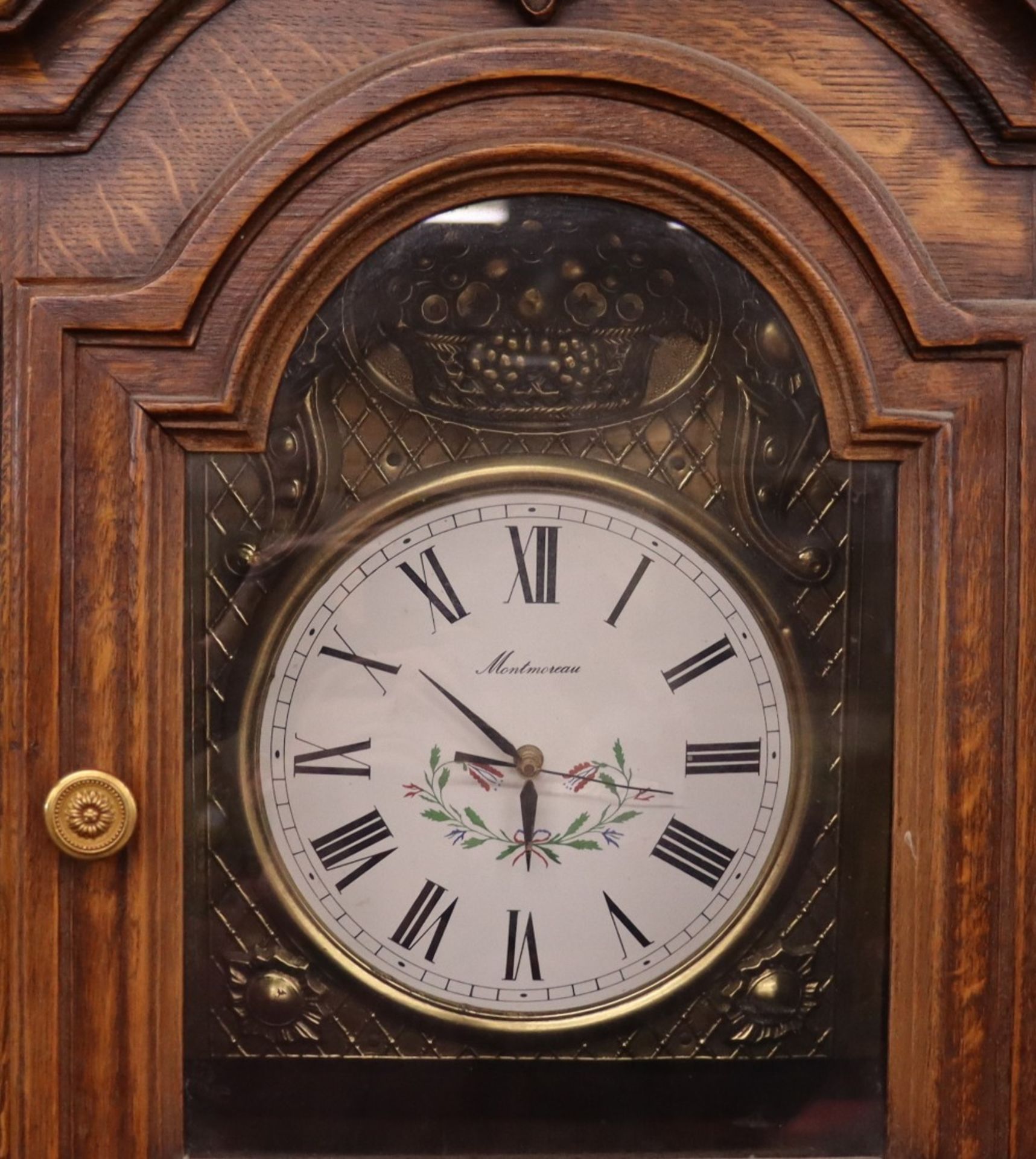 A carved oak long case clock, with associated French battery powered movement, 212cm high