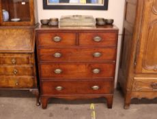 A 19th Century mahogany chest of two short and three long drawers, cut in two sections raised on a