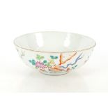A Chinese Famille Rose bowl, six character mark to base with old paper label dated 1921