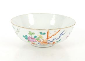 A Chinese Famille Rose bowl, six character mark to base with old paper label dated 1921