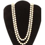 A pearl double strand necklace with silver pearl set clasp, 77cm long, total weight 169gms