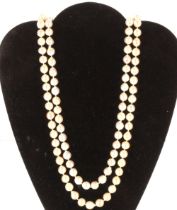 A pearl double strand necklace with silver pearl set clasp, 77cm long, total weight 169gms