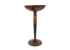 A decorative aesthetic movement stand, having stylised foliate decoration on circular spread foot,