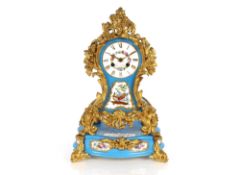A Sevres style pale blue porcelain mantel clock on plinth, decorated foliate and bird panels with
