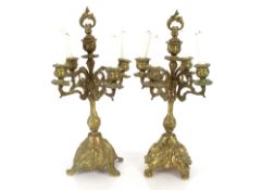 A pair of ornate 19th Century brass five light candelabra, 50cm high