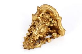 A 19th Century carved gilt wood Florentine style wall bracket with acanthus scroll decoration,