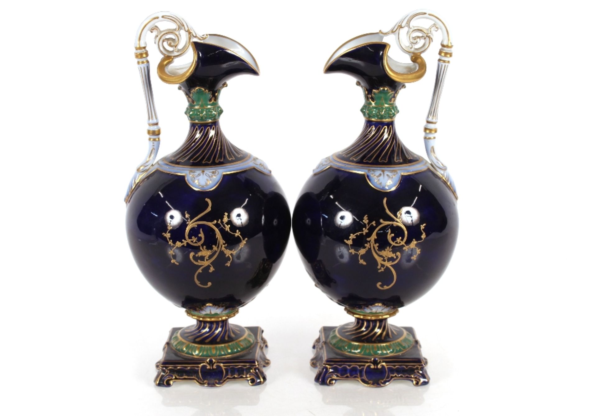 A pair of Sevres style ewers, having floral spray decorated central panels on apple green and cobalt - Image 2 of 4