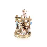 A 19th Century Meissen figure group, depicting children around a grape press, having encrusted