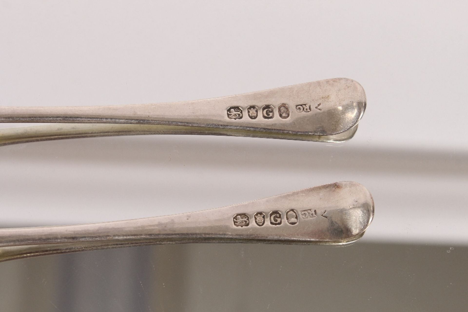 Nine George III silver "Old English" pattern dessert spoons, bearing family crests, London 1802; and - Image 8 of 8