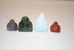 A Chinese carved milky quartz Buddha and three oth