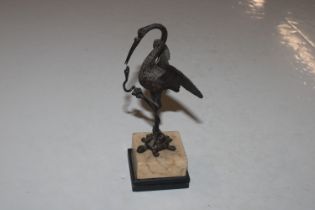 A bronze sculpture in the form of a crane with snake standing on a turtle, 21cm high