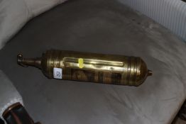 A vintage brass cased Pyrene fire extinguisher