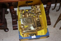 A box of various brass rim locks and handles