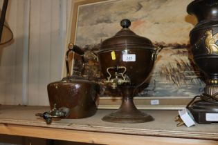 An antique copper samovar and a copper kettle with