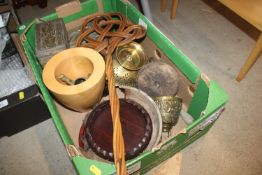 A box containing various brass bells, wooden ware,