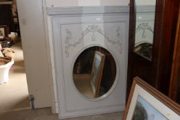 A large decorative grey painted wall mirror