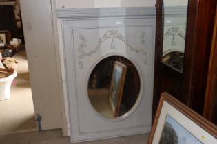 A large decorative grey painted wall mirror