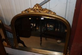 A decorative gilt framed wall mirror