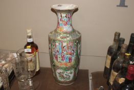 A 19th Century Canton baluster vase decorated in the traditional palette with figures birds and