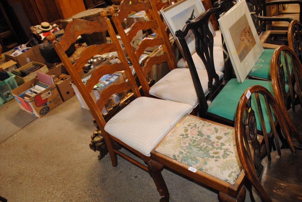 A set of six oak ladder back dining chairs