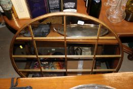 A large circular gilt framed wall mirror