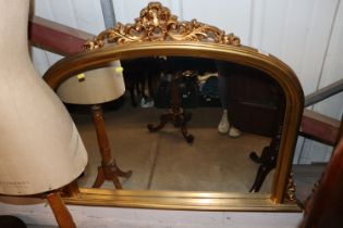 A decorative gilt framed wall mirror