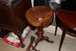 A Victorian walnut trumpet shaped sewing table